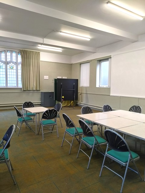 View of back of hall with windows to the back.