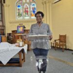 Maria stood at the lectern reading the Bible