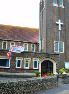 Bognor Regis Methodist Church side view with table top sale banner, July 2025 