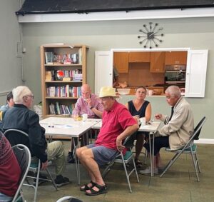 People eating lunch in the church hall.