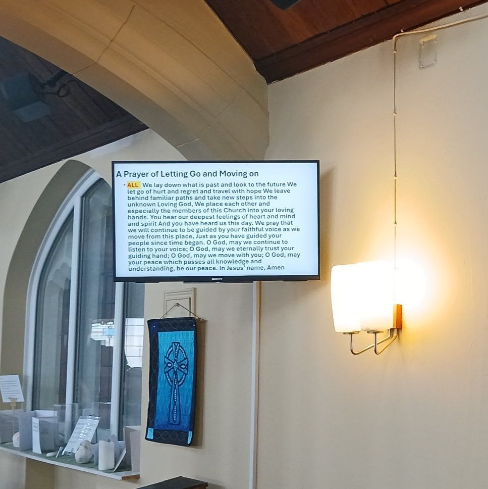 Screen with prayers said in the church for its final service